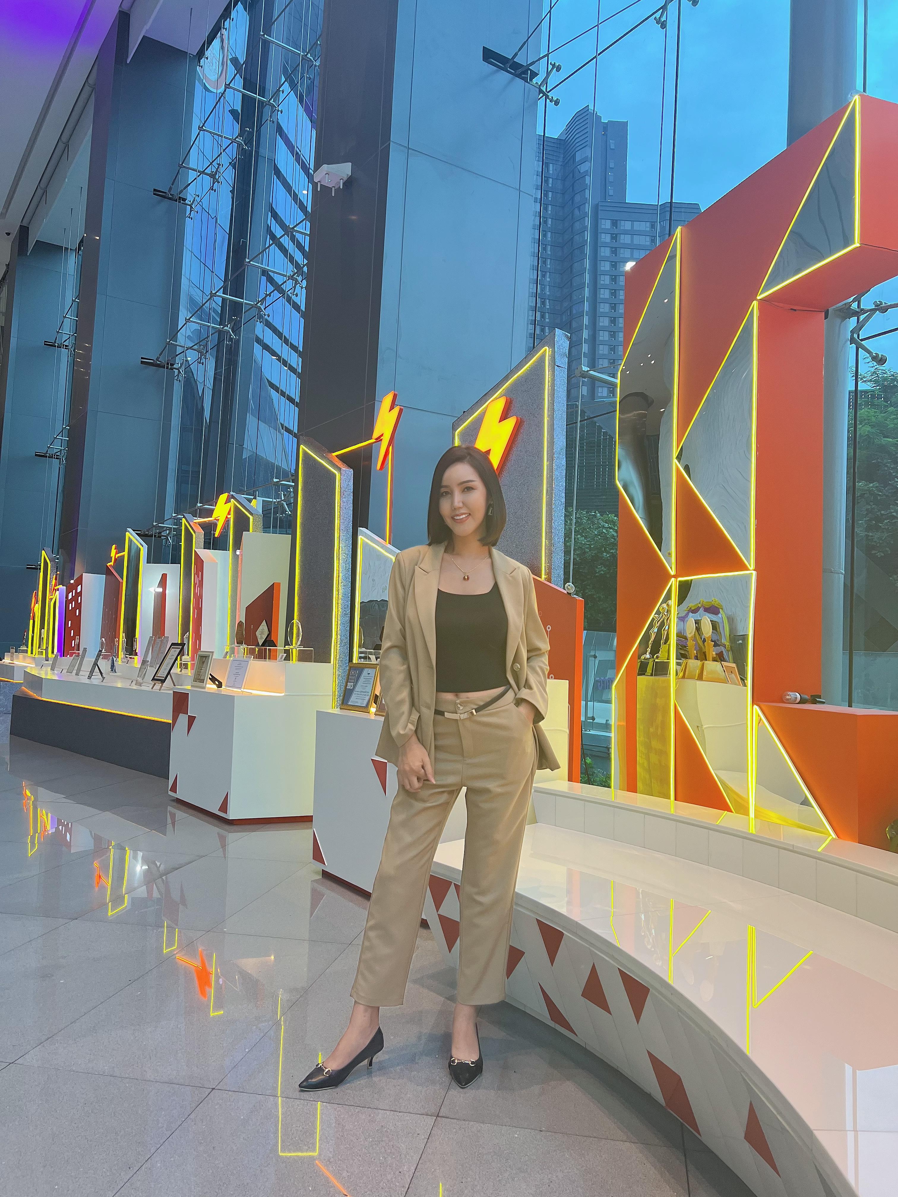 Chanya in a colourful professional setting