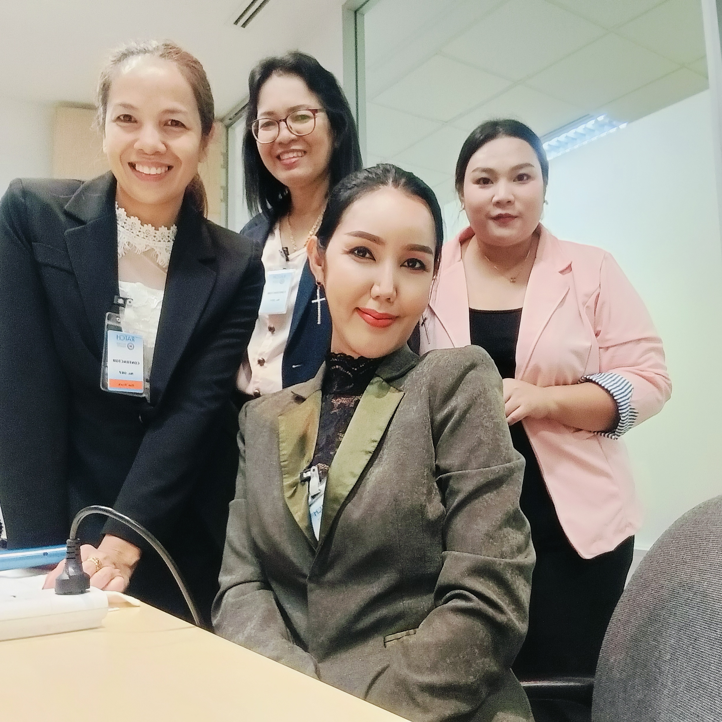 Chanya with her professional makeup and creative crew